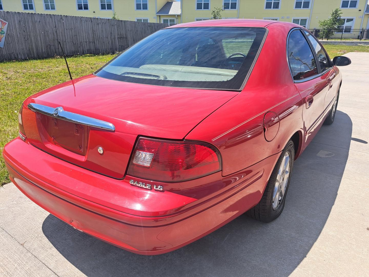 2003 RED /BEIGE Mercury Sable (1MEFM55S43A) , located at 1181 Aurora Rd, Melbourne, FL, 32935, (321) 241-1100, 28.132914, -80.639175 - Photo#2